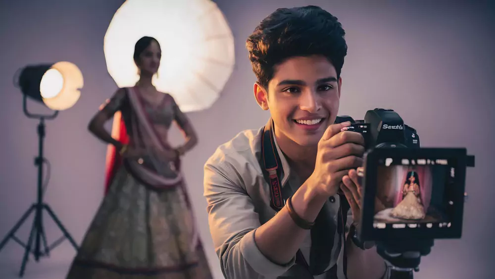 A camera man taking picture of a bride